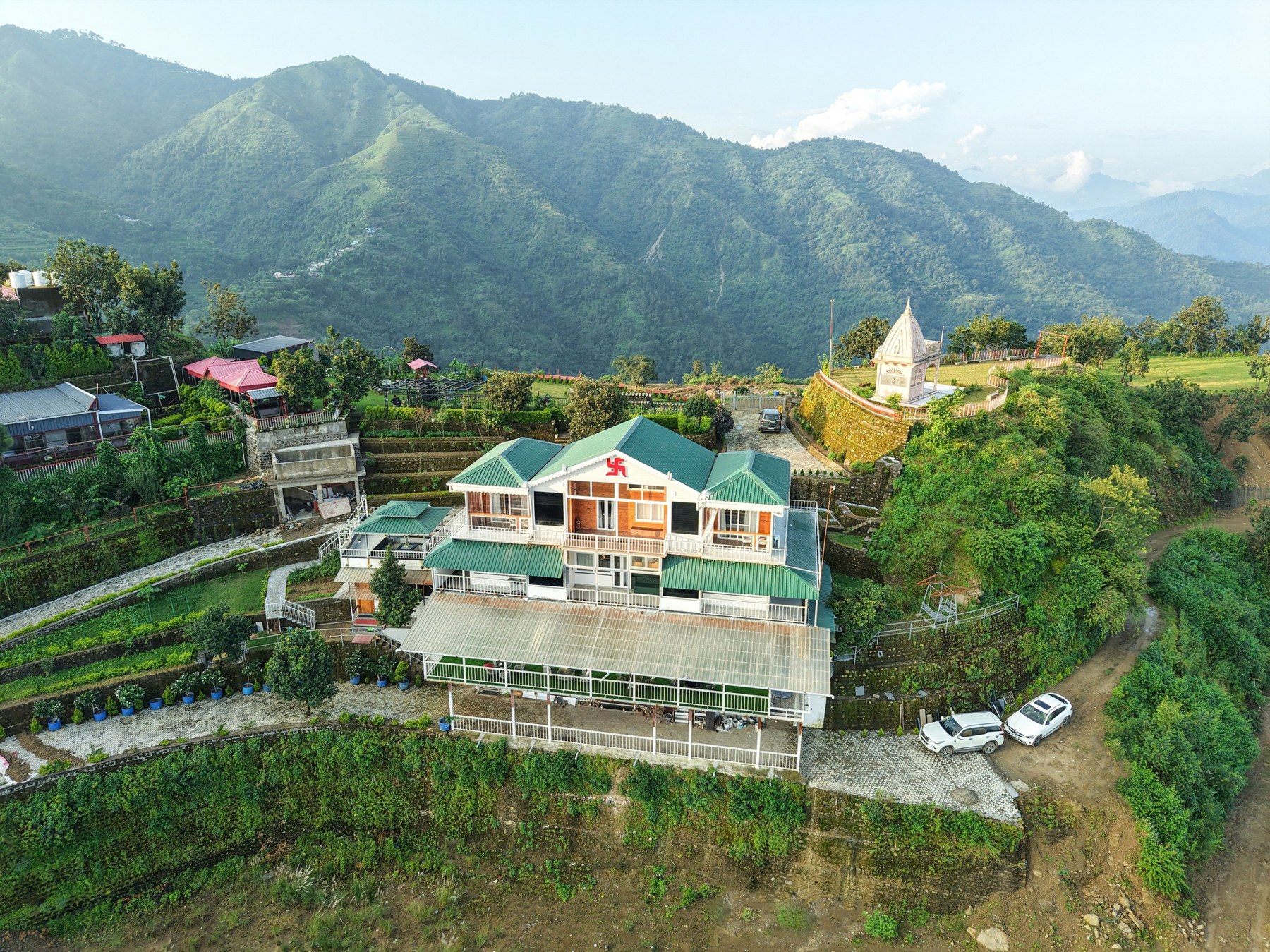 Mountain road and hillside property landscape from the client's Terra Veda material