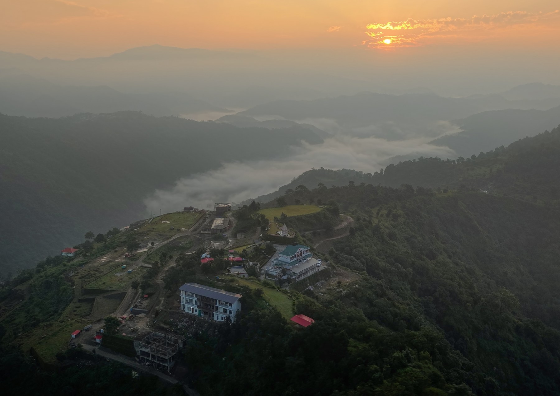 Sunrise over the hills and terraced site surroundings